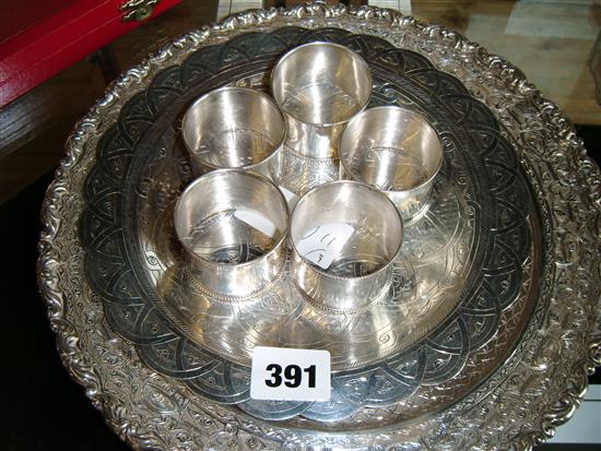 Two Egyptian silver engraved dishes and five napkin rings